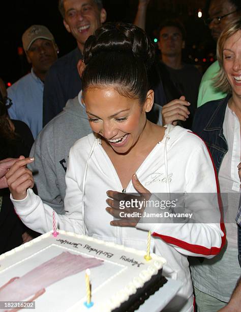 Jennifer Lopez blows out the candles on her birthday cake