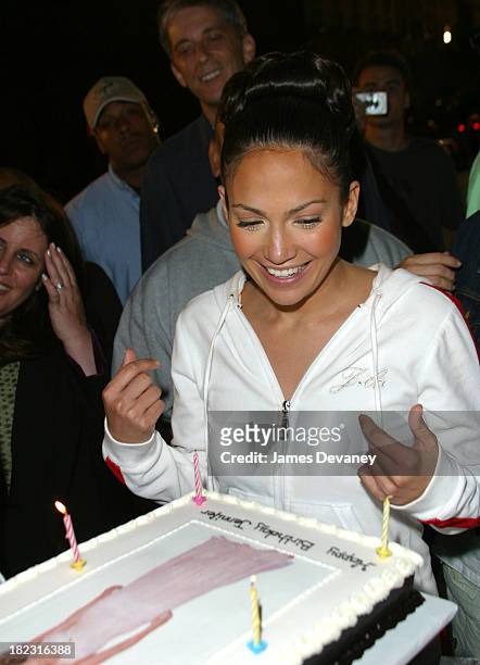 Jennifer Lopez checks out her birthday cake during Jennifer Lopez Celebrates Her 32nd Birthday On Location for Maid in Manhattan at Metropolitan...