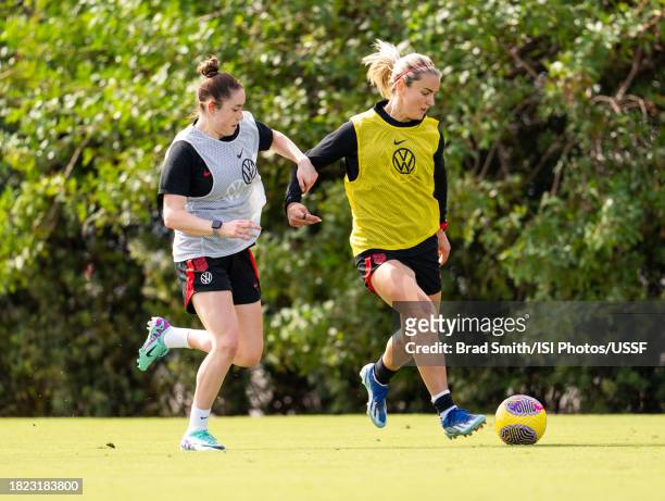 Lindsey Horan is defended by Olivia Moultrie of the United States during USWNT training at Florida Blue Training Center on November 30, 2023 in Fort...