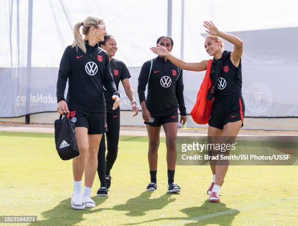Lindsey Horan, Casey Krueger, Naomi Girma and Lynn Williams of the United States arrive at the field before USWNT training at Florida Blue Training...