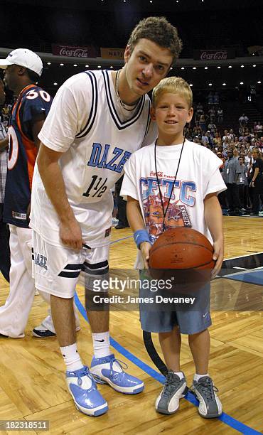 Justin Timberlake and fan during *NSYNC Challenge for the Children IV - Celebrity Basketball Game at TD Waterhouse Centre in Orlando, Florida, United...