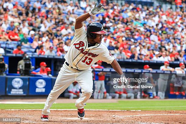 Jose Constanza of the Atlanta Braves hits an RBI single in the fifth inning against the Philadelphia Phillies at Turner Field on September 29, 2013...