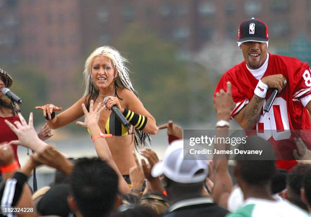 Christina Aguilera and Redman during Christina Aguilera Performs at the Brooklyn Bridge at Empire Fulton State Park in Brooklyn, New York, United...