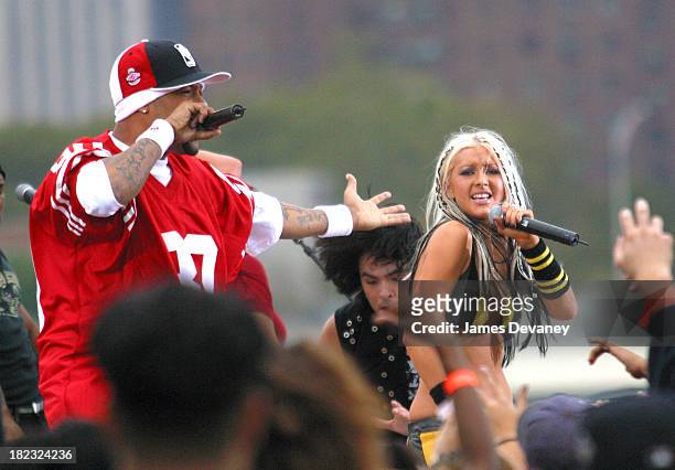 Christina Aguilera and Redman during Christina Aguilera Performs at the Brooklyn Bridge at Empire Fulton State Park in Brooklyn, New York, United...