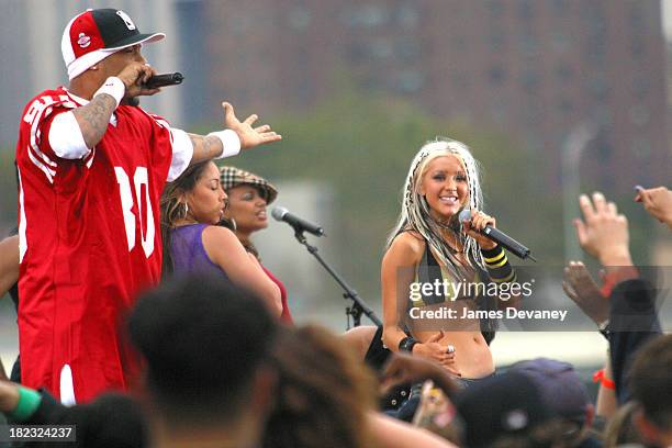 Christina Aguilera and Redman during Christina Aguilera Performs at the Brooklyn Bridge at Empire Fulton State Park in Brooklyn, New York, United...