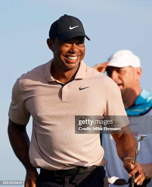 Tiger Woods of the United States walks off the 18th hole during the first round of the Hero World Challenge at Albany Golf Course on November 30,...