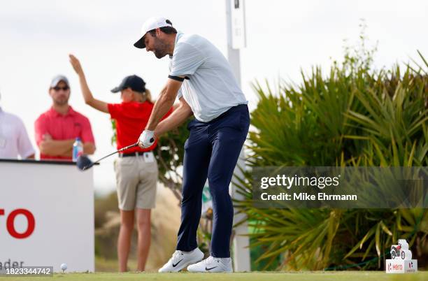 Scottie Scheffler of the United States plays his shot from the 15th tee during the first round of the Hero World Challenge at Albany Golf Course on...