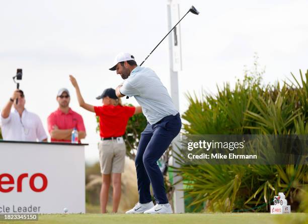 Scottie Scheffler of the United States plays his shot from the 15th tee during the first round of the Hero World Challenge at Albany Golf Course on...