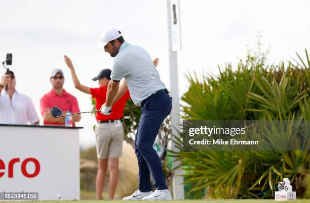Scottie Scheffler of the United States plays his shot from the 15th tee during the first round of the Hero World Challenge at Albany Golf Course on...