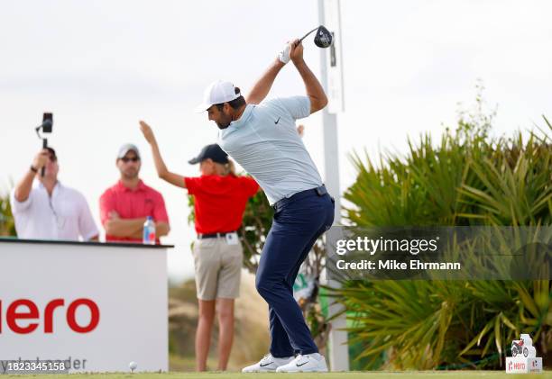 Scottie Scheffler of the United States plays his shot from the 15th tee during the first round of the Hero World Challenge at Albany Golf Course on...