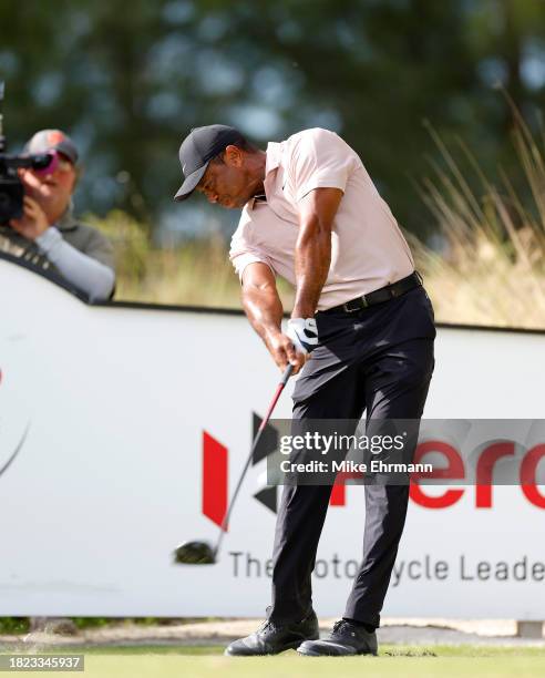 Tiger Woods of the United States plays his shot from the tenth tee during the first round of the Hero World Challenge at Albany Golf Course on...