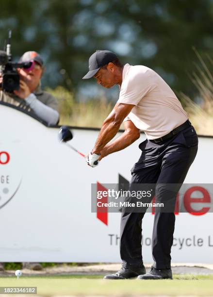 Tiger Woods of the United States plays his shot from the tenth tee during the first round of the Hero World Challenge at Albany Golf Course on...