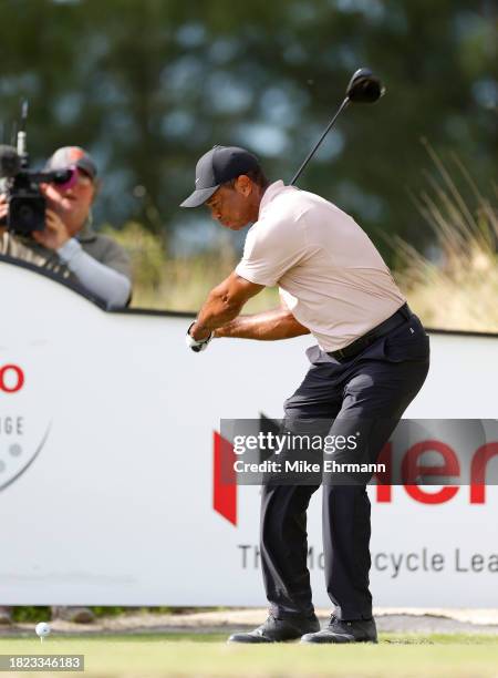 Tiger Woods of the United States plays his shot from the tenth tee during the first round of the Hero World Challenge at Albany Golf Course on...