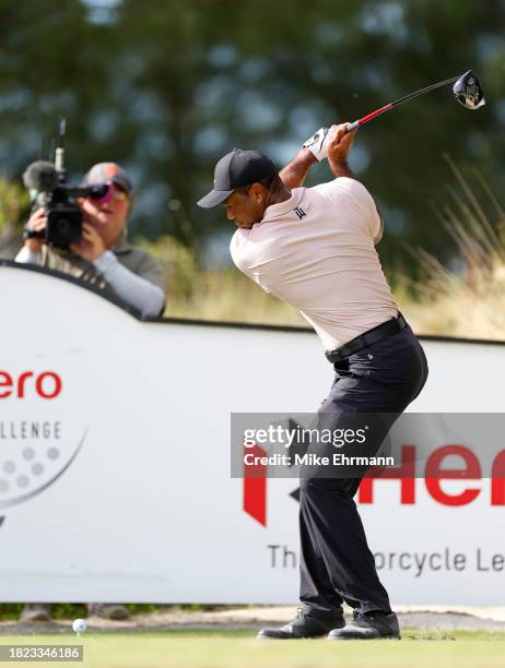 Tiger Woods of the United States plays his shot from the tenth tee during the first round of the Hero World Challenge at Albany Golf Course on...