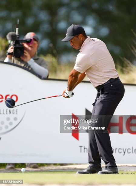Tiger Woods of the United States plays his shot from the tenth tee during the first round of the Hero World Challenge at Albany Golf Course on...