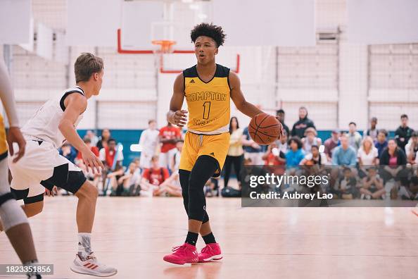 Compton Magic Guard Mikey Williams of Compton Magic dribbles through the paint ...