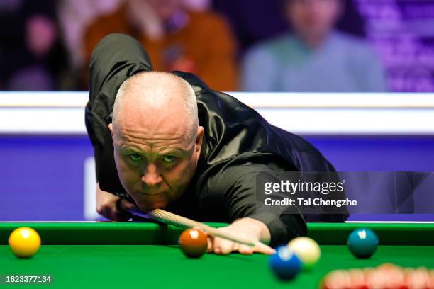 John Higgins of Scotland plays a shot in the second round match against Zhou Yuelong of China on day 6 of the 2023 MrQ UK Championship at Barbican...