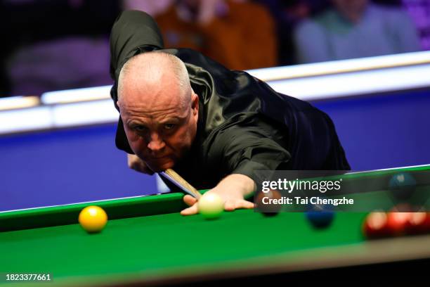 John Higgins of Scotland plays a shot in the second round match against Zhou Yuelong of China on day 6 of the 2023 MrQ UK Championship at Barbican...