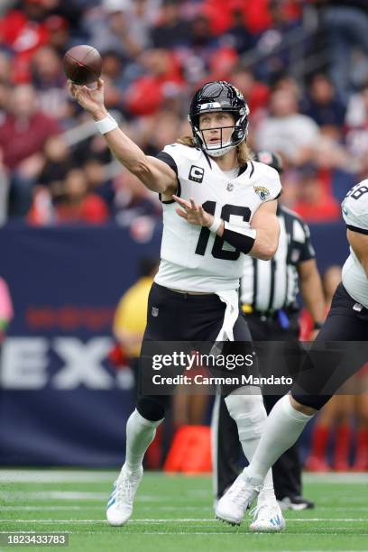 Trevor Lawrence of the Jacksonville Jaguars in action against the Houston Texans at NRG Stadium on November 26, 2023 in Houston, Texas.