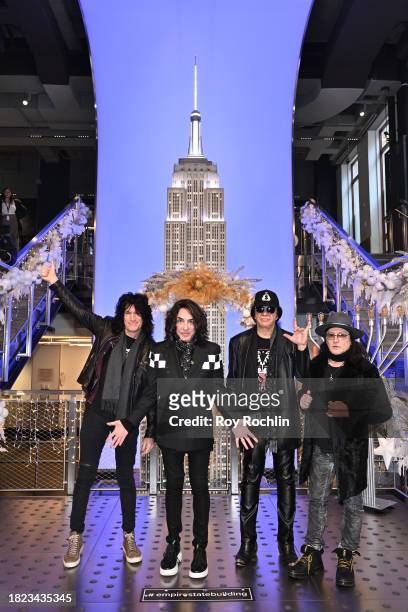 Tommy Thayer, Paul Stanley, Gene Simmons, and Eric Singer of KISS pose as they light the Empire State Building in celebration of the band's final...