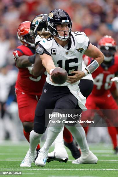 Trevor Lawrence of the Jacksonville Jaguars in action against the Houston Texans at NRG Stadium on November 26, 2023 in Houston, Texas.