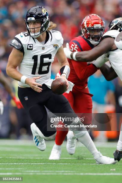 Trevor Lawrence of the Jacksonville Jaguars in action against the Houston Texans at NRG Stadium on November 26, 2023 in Houston, Texas.