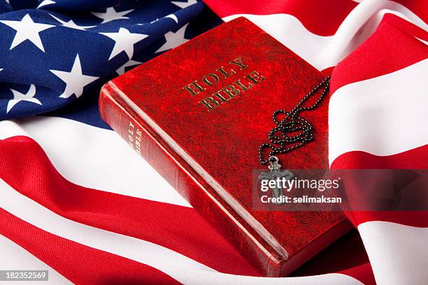 holy bible and cross on american flag - american flag church stock pictures, royalty-free photos & images