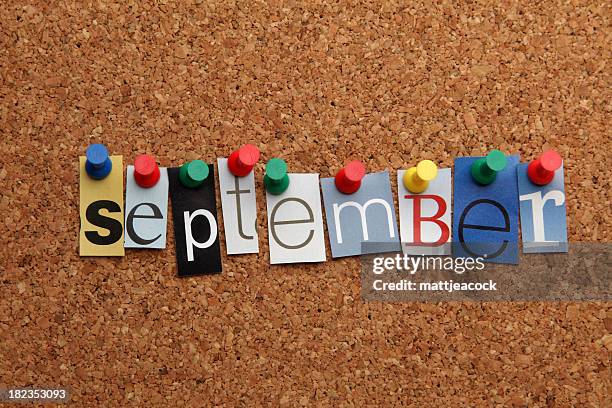 september pinned on noticeboard - september stockfoto's en -beelden