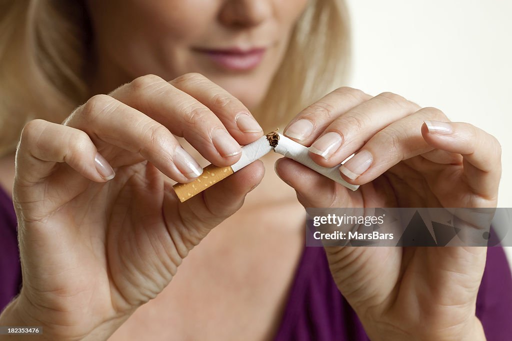 Quit smoking, breaking a cigarette