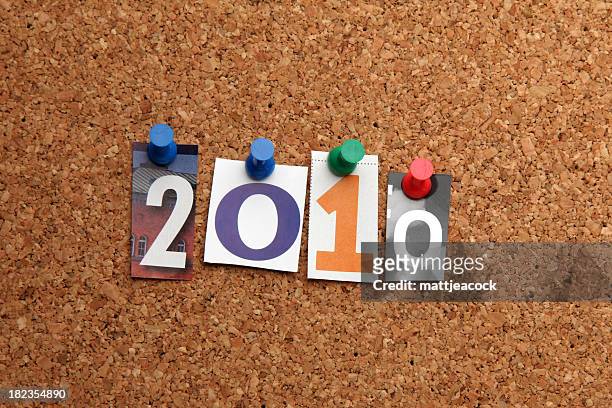 new year 2010 pinned on noticeboard - 2010 bildbanksfoton och bilder