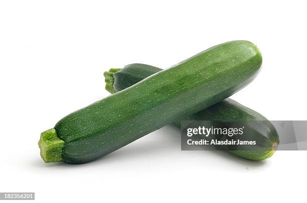 two courgettes - mergpompoen stockfoto's en -beelden