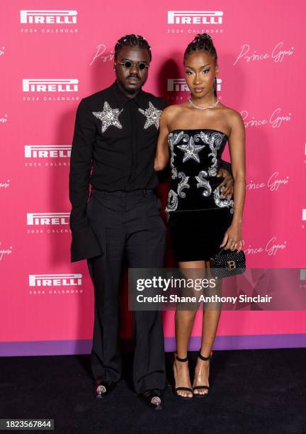 Prince Gyasi and Sarah Phenom arrive at the unveiling of the 2024 Pirelli Calendar by Prince Gyasi at Magazine London on November 30, 2023 in London,...