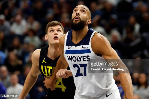 Rudy Gobert of the Minnesota Timberwolves and Walker Kessler of the Utah Jazz compete for the rebound in the first quarter at Target Center on...