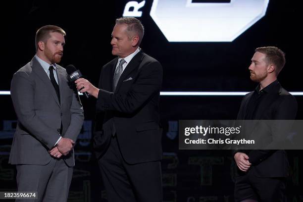 Host Marty Snider interviews NASCAR Cup Series drivers, Chris Buescher and Tyler Reddick onstage during the NASCAR Awards and Champion Celebration at...