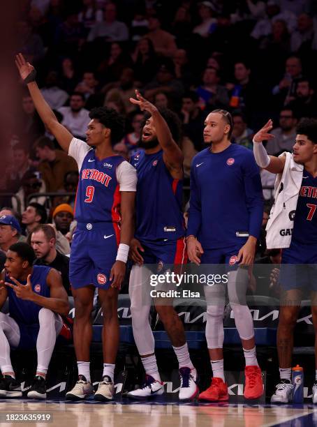 Ausar Thompson of the Detroit Pistons and the rest of the Detroit Pistons bench celebrate teammate's three point shot in the third quarter against...