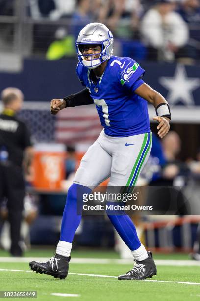 Geno Smith of the Seattle Seahawks celebrates after a touchdow during an NFL football game between the Dallas Cowboys and the Seattle Seahawks at...