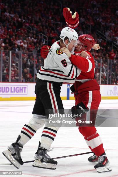 Connor Murphy of the Chicago Blackhawks fights with Klim Kostin of the Detroit Red Wings during the second period at Little Caesars Arena on November...