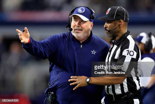 Head coach Mike McCarthy of the Dallas Cowboys talks with a referee on the sidelines during the 2nd quarter of the game against the Seattle Seahawks...
