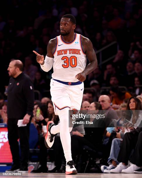 Julius Randle of the New York Knicks celebrates his shot in the second half against the Detroit Pistons at Madison Square Garden on November 30, 2023...