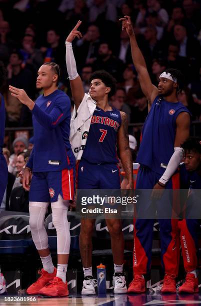 Kevin Knox II,Killian Hayes and Stanley Umude of the Detroit Pistons celebrate a teammate's three point shot against the New York Knicks at Madison...