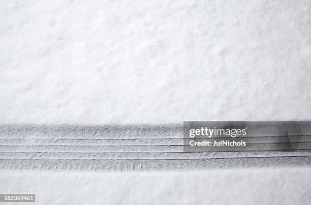 tire track in snow - tire track stock pictures, royalty-free photos & images