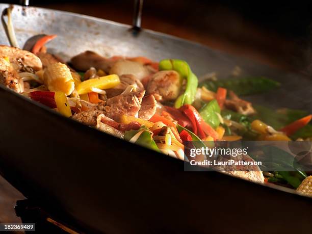 chicken and vegetable stir fry - stir fried stock pictures, royalty-free photos & images