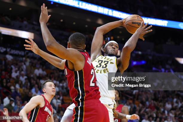 Myles Turner of the Indiana Pacers rebounds the ball against the Miami Heat during the fourth quarter of the game at Kaseya Center on November 30,...