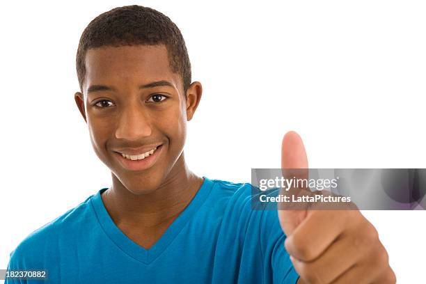 afrikanischer abstammung teenager junge geben gestikulieren daumen hoch - black thumbs up white background stock-fotos und bilder