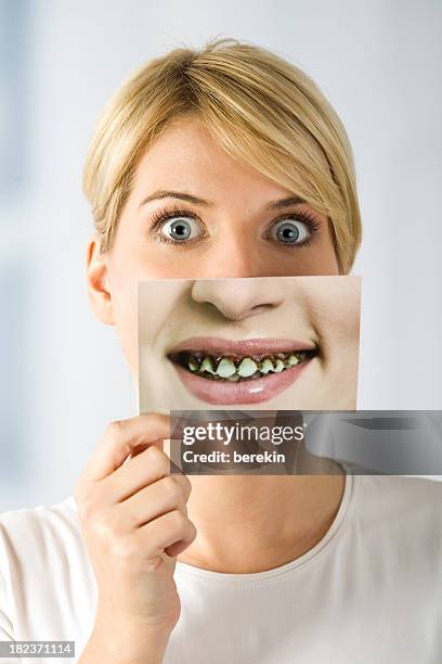 woman with image of rotten teeth - lelijkheid stockfoto's en -beelden
