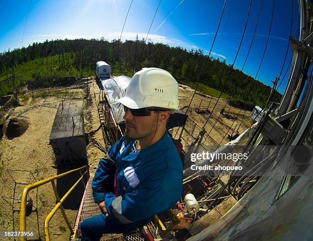 driller standing on the ladder - hand wide angle stock pictures, royalty-free photos & images