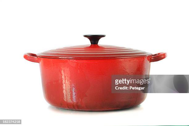 red casserole dish on white background - ovenschotel stockfoto's en -beelden