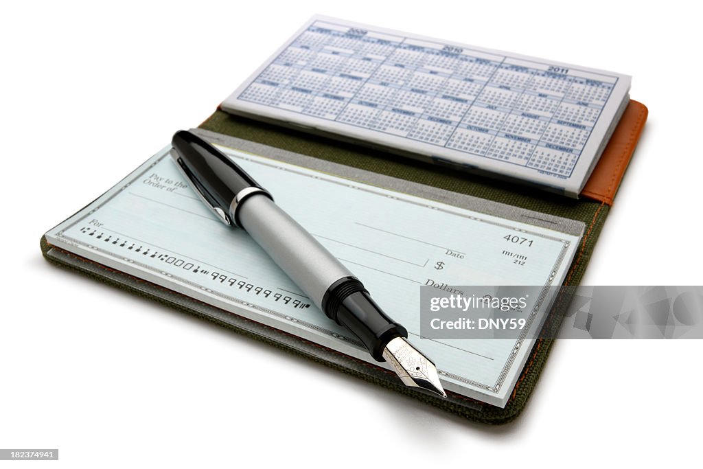 Open checkbook and fountain pen on white background