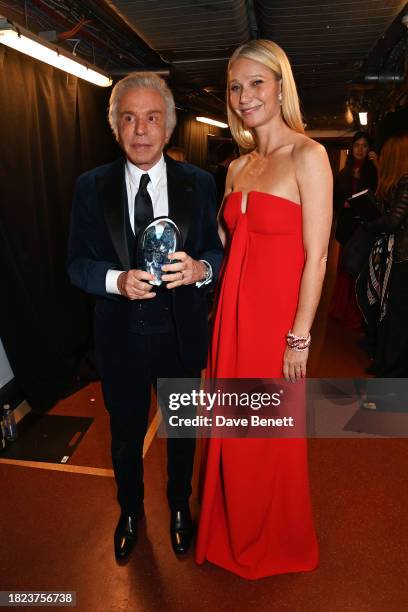 Giancarlo Giammetti, accepting the Outstanding Achievement Award on behalf of Valentino Garavani, and Gwyneth Paltrow pose backstage at The Fashion...