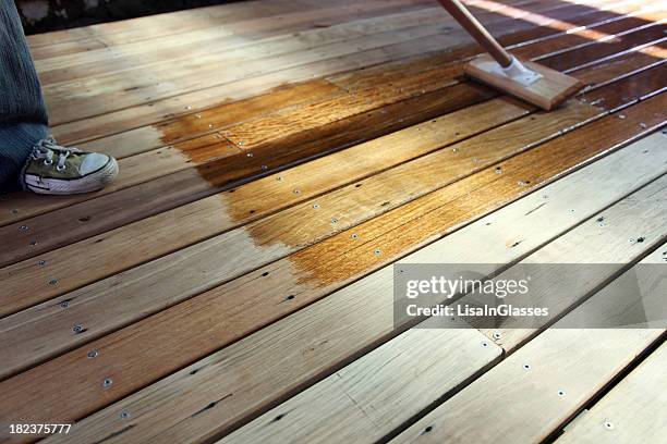 oiling the deck - deck stock pictures, royalty-free photos & images